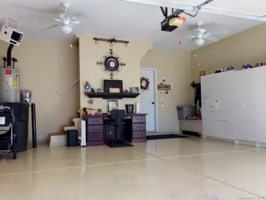 3233 Sapphire Lane Fort Mill, SC 29708 - Photo 21 of 24 a view of a workspace with furniture and a ceiling fan