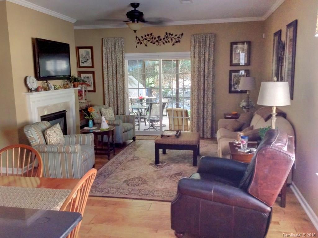 3233 Sapphire Lane Fort Mill, SC 29708 - Photo 8 of 24 a living room with furniture a flat screen tv and a fireplace