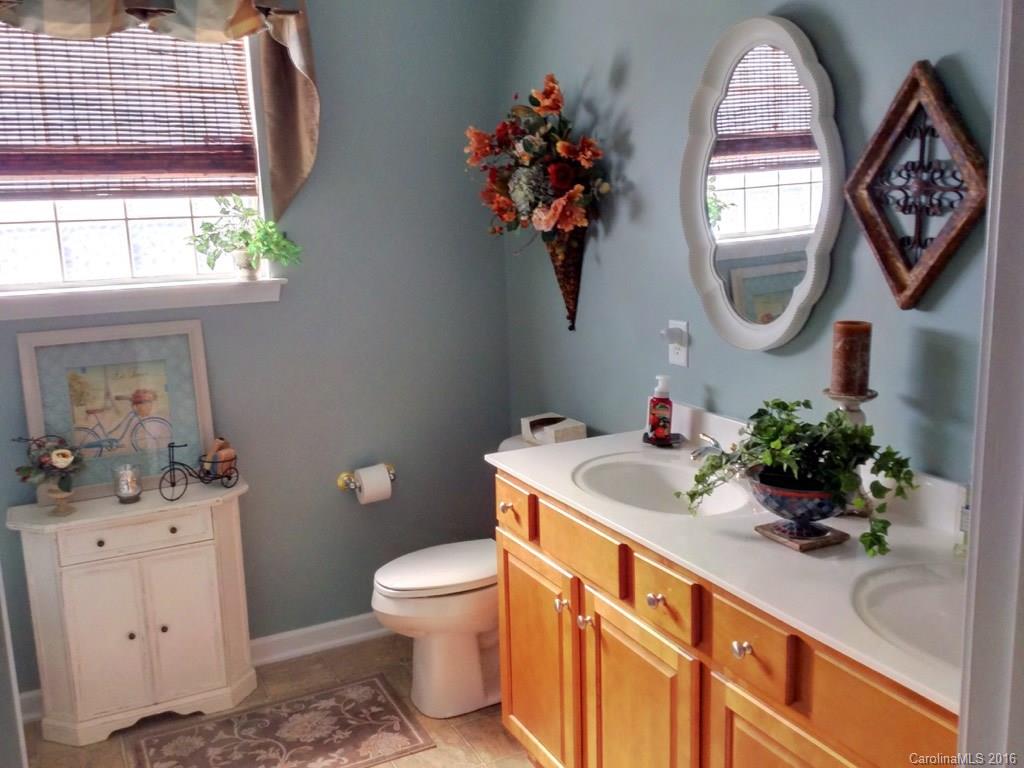 3233 Sapphire Lane Fort Mill, SC 29708 - Photo 10 of 24 a bathroom with a sink mirror and toilet