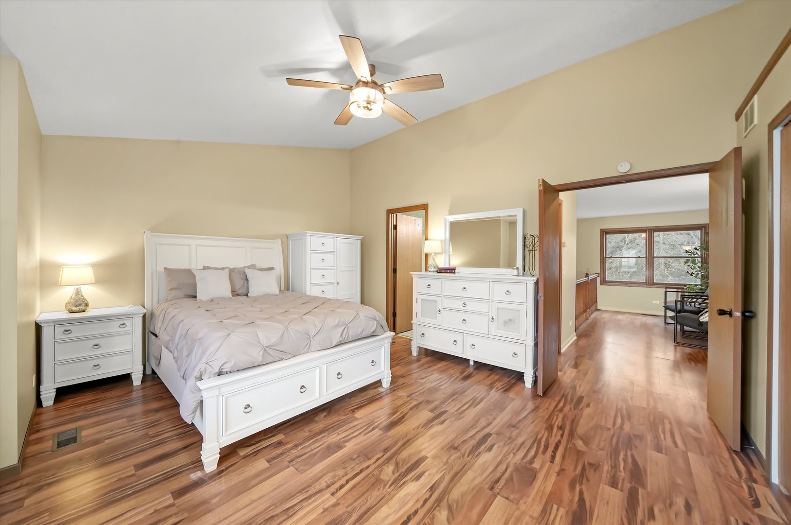 144 Spring Court North Carpentersville, IL 60110 - Photo 17 of 36 a bedroom with a bed and a chandelier