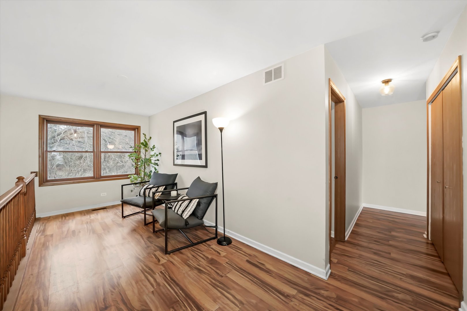 144 Spring Court North Carpentersville, IL 60110 - Photo 20 of 36 a living room with furniture and a wooden floor