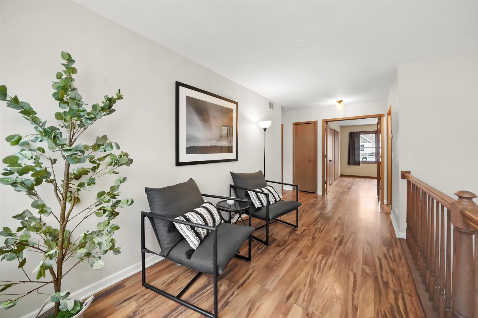 144 Spring Court North Carpentersville, IL 60110 - Photo 22 of 36 a living room with furniture and wooden floor