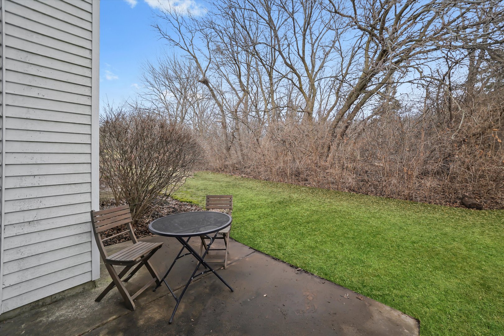 144 Spring Court North Carpentersville, IL 60110 - Photo 6 of 36 a view of a chairs and table in backyard