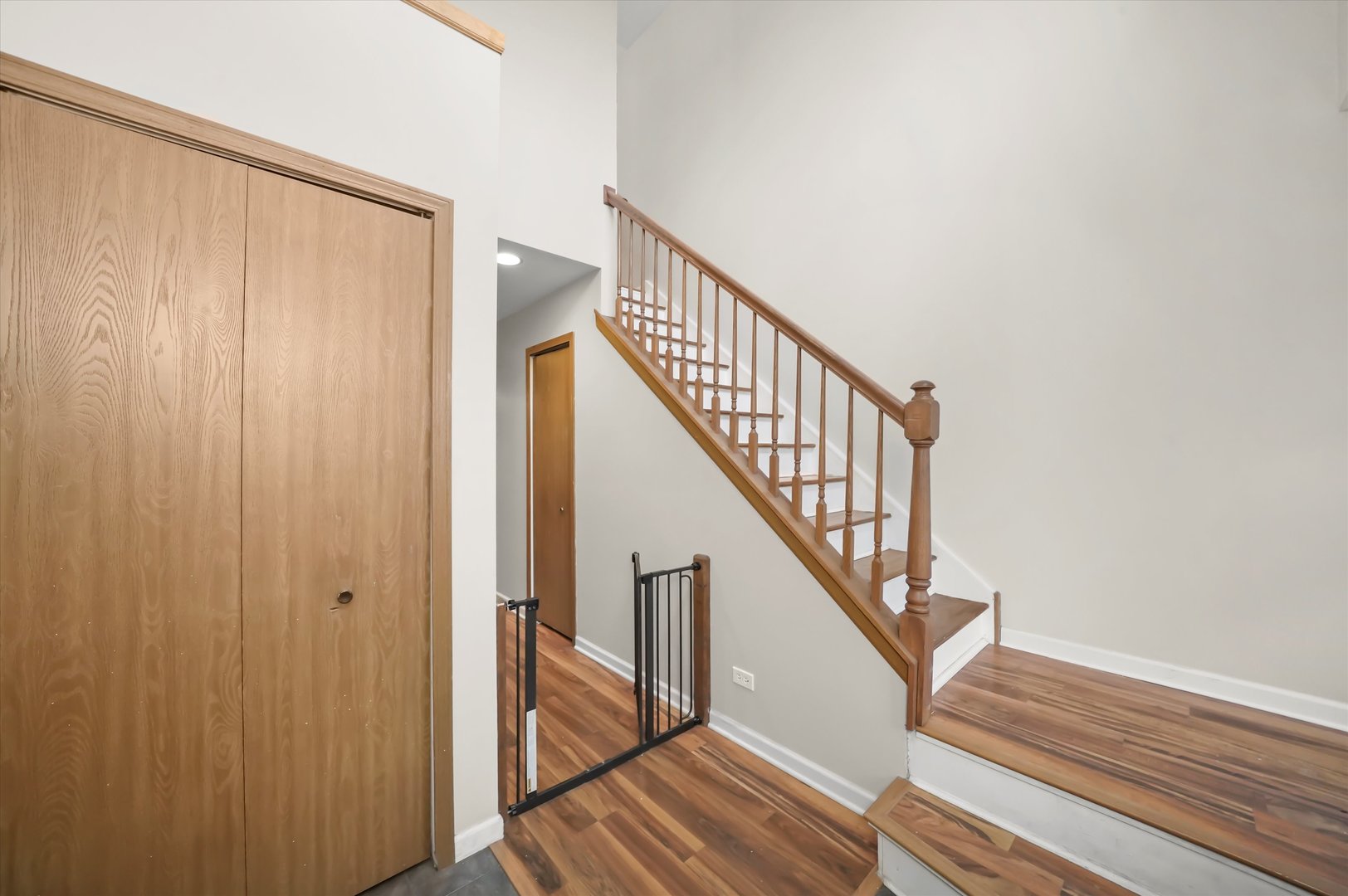 144 Spring Court North Carpentersville, IL 60110 - Photo 7 of 36 a view of staircase with wooden floor and fan