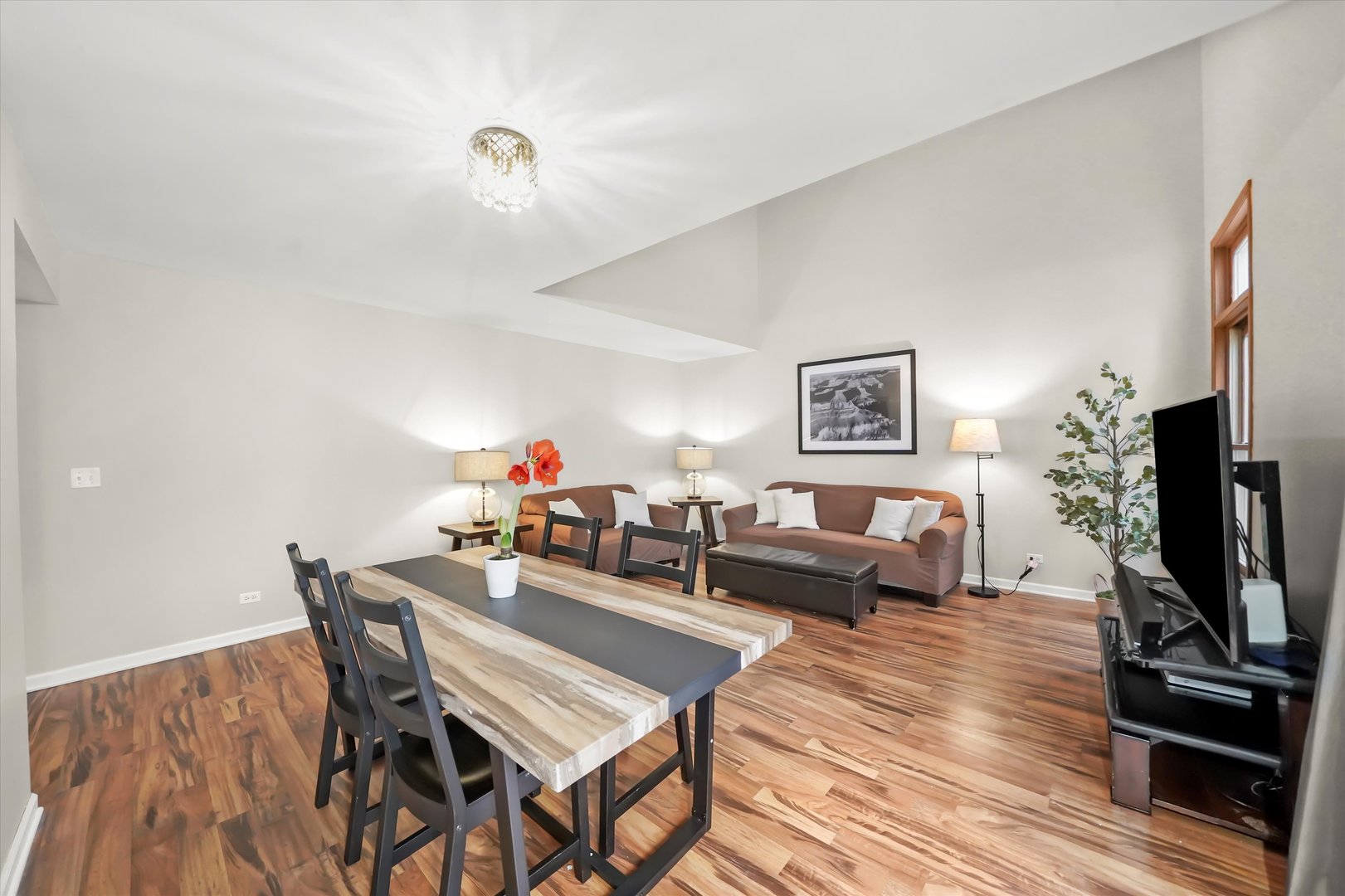 144 Spring Court North Carpentersville, IL 60110 - Photo 8 of 36 a living room with furniture a flat screen tv and a table
