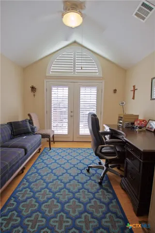 a living room with furniture and a window