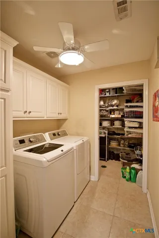 a kitchen with a stove and a refrigerator