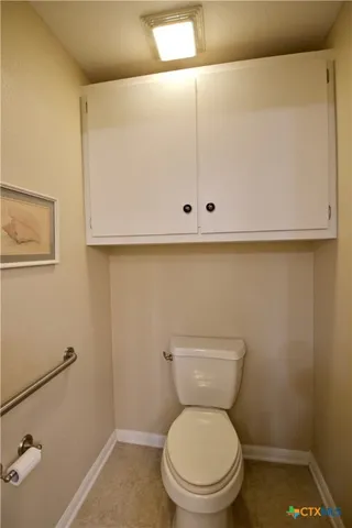 a bathroom with a toilet