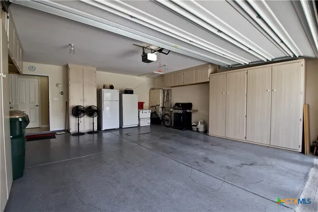 a view of a livingroom with furniture and a ceiling fan