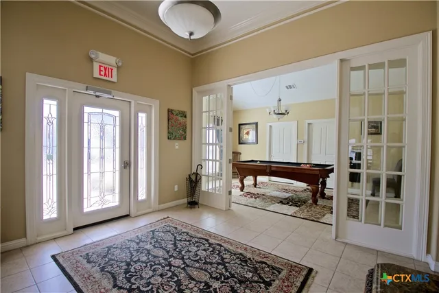 a bedroom with furniture and a window