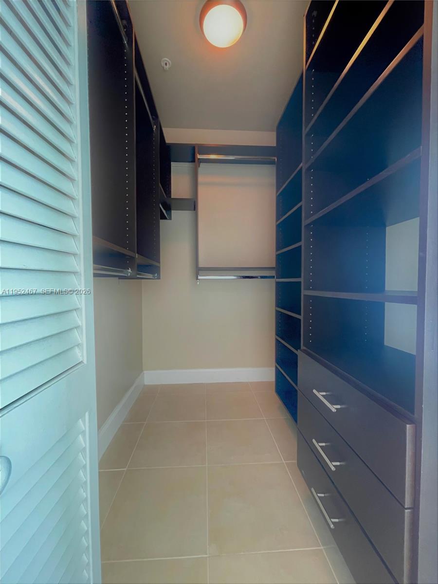 2525 Southwest 3rd Avenue, Unit 1709 Miami, FL 33129 - Photo 8 of 15 a view of walk in closet