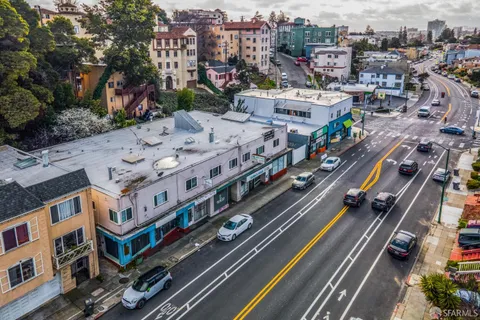 a bathroom with a tub a sink and mirror