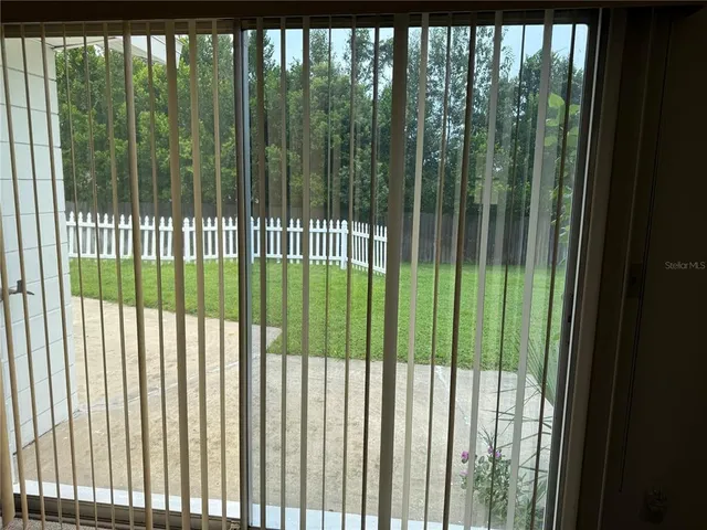 a view of a backyard from a balcony