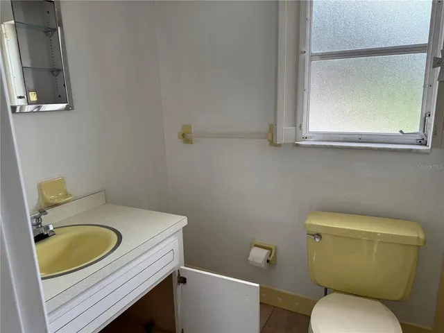 a bathroom with a sink and a toilet