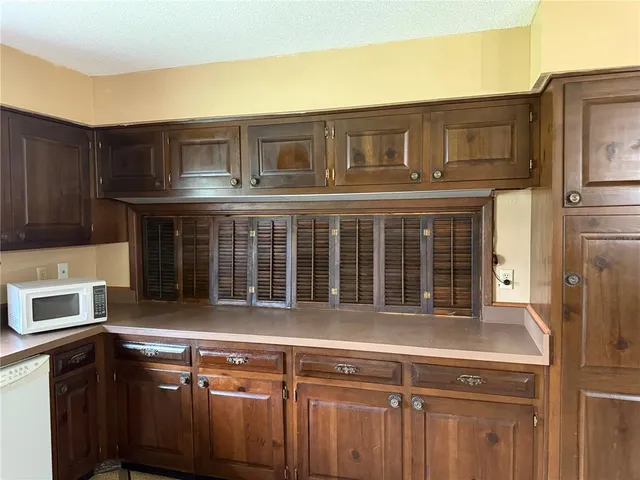 a view of a house with a sink and a refrigerator