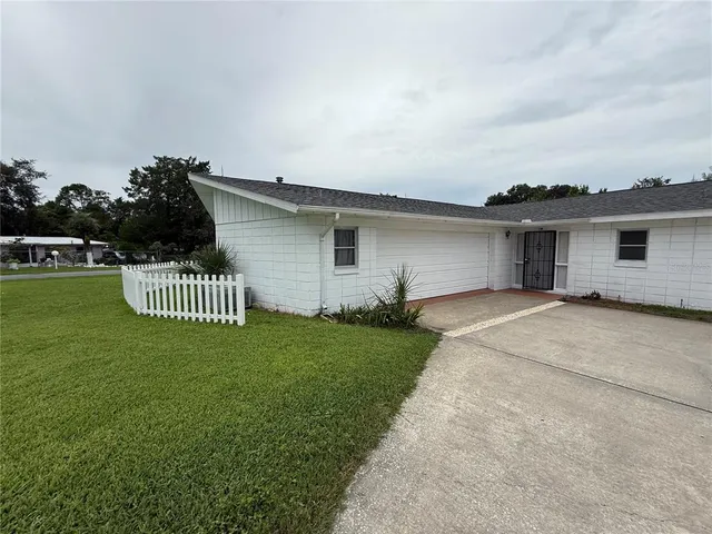 front view of a house with a garden