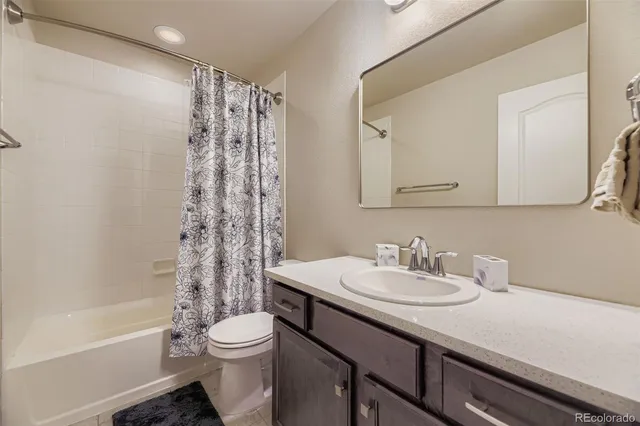 a bathroom with a sink a toilet and a bathtub