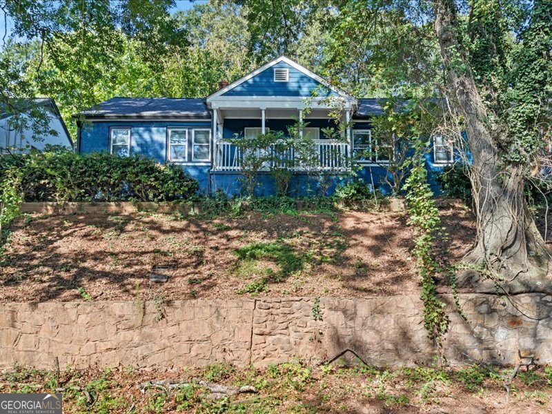 253 Lawton Street Southwest Atlanta, GA 30314 - Photo 1 of 1 a front view of a house with garden