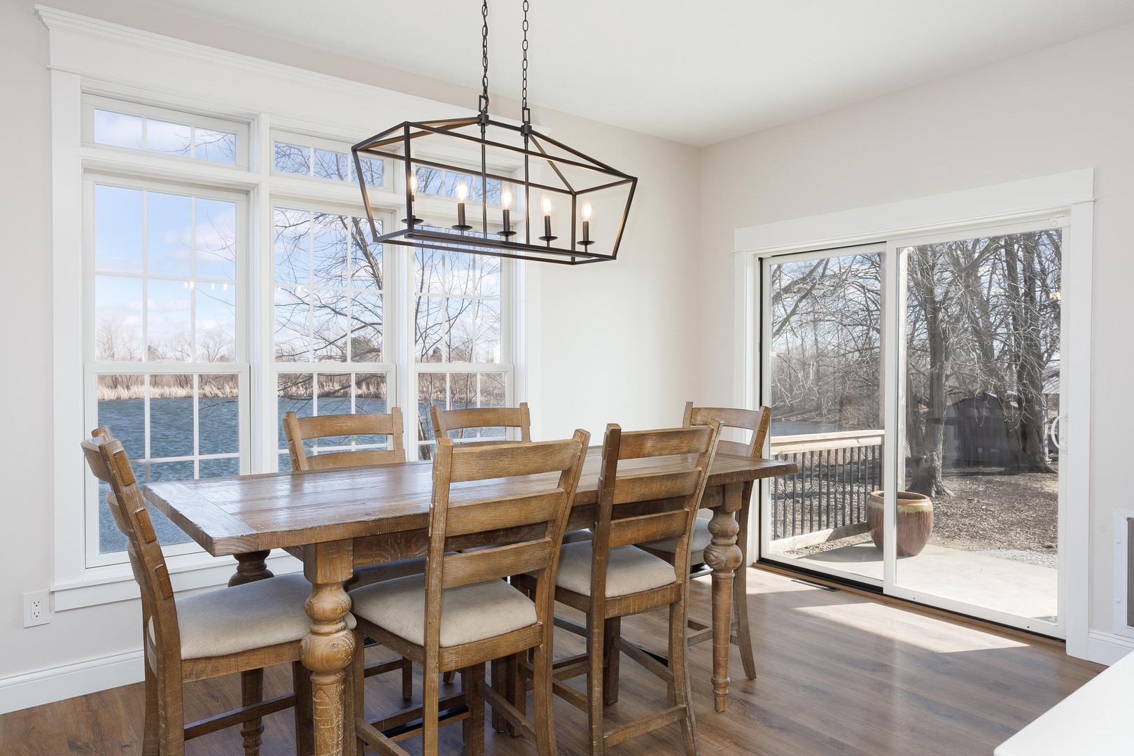 1651 North 2800 East Road Le Roy, IL 61752 - Photo 21 of 90 a dining room with wooden floor a chandelier a wooden table and chairs