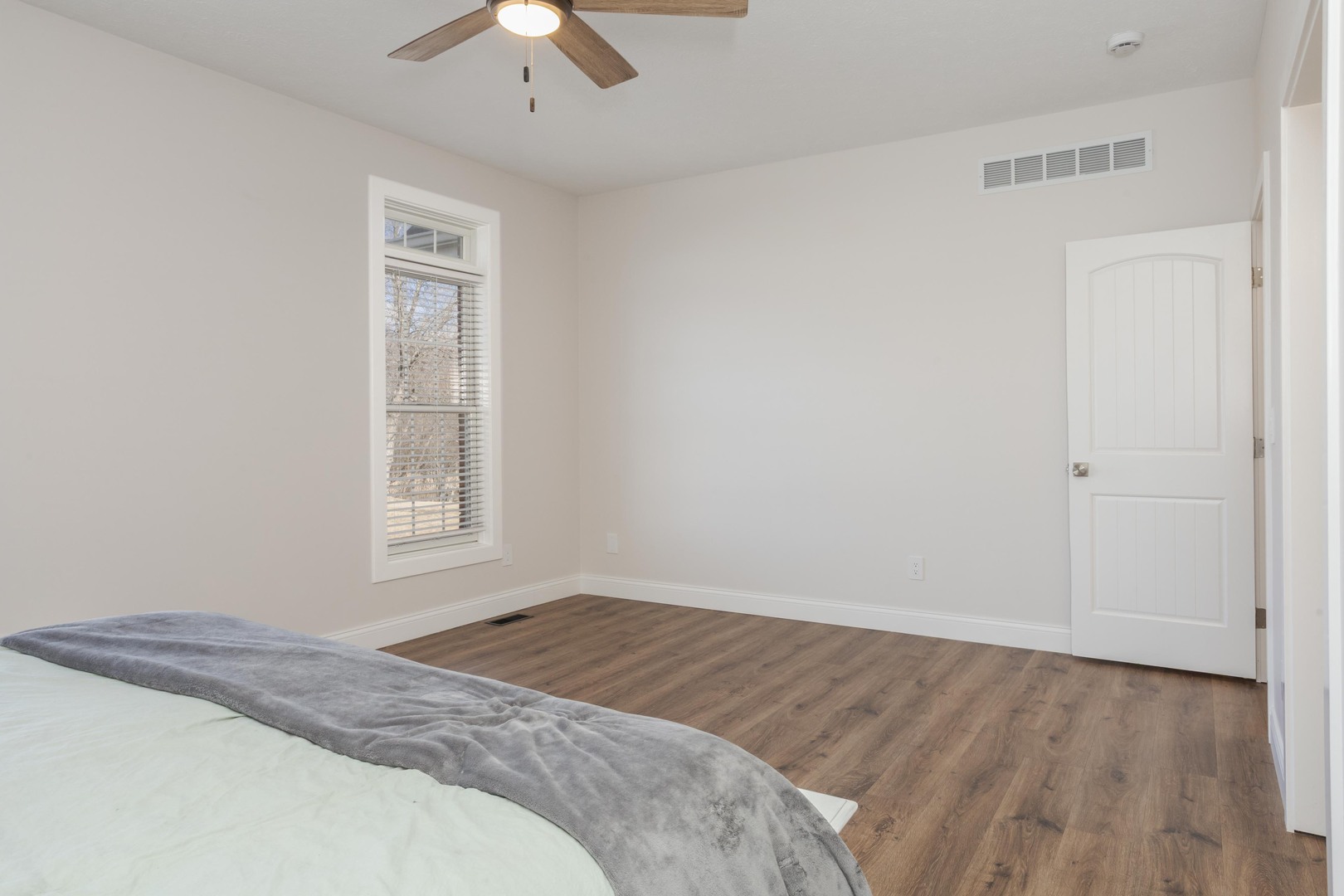 1651 North 2800 East Road Le Roy, IL 61752 - Photo 27 of 90 a bedroom with a bed and a chandelier fan