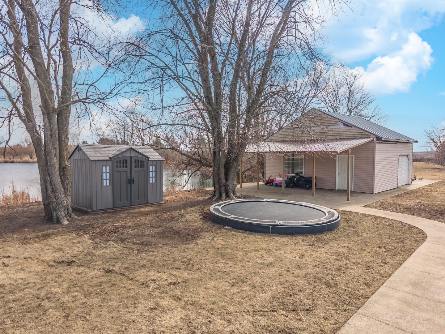 1651 North 2800 East Road Le Roy, IL 61752 - Photo 53 of 90 a backyard of a house with trees and barbeque oven