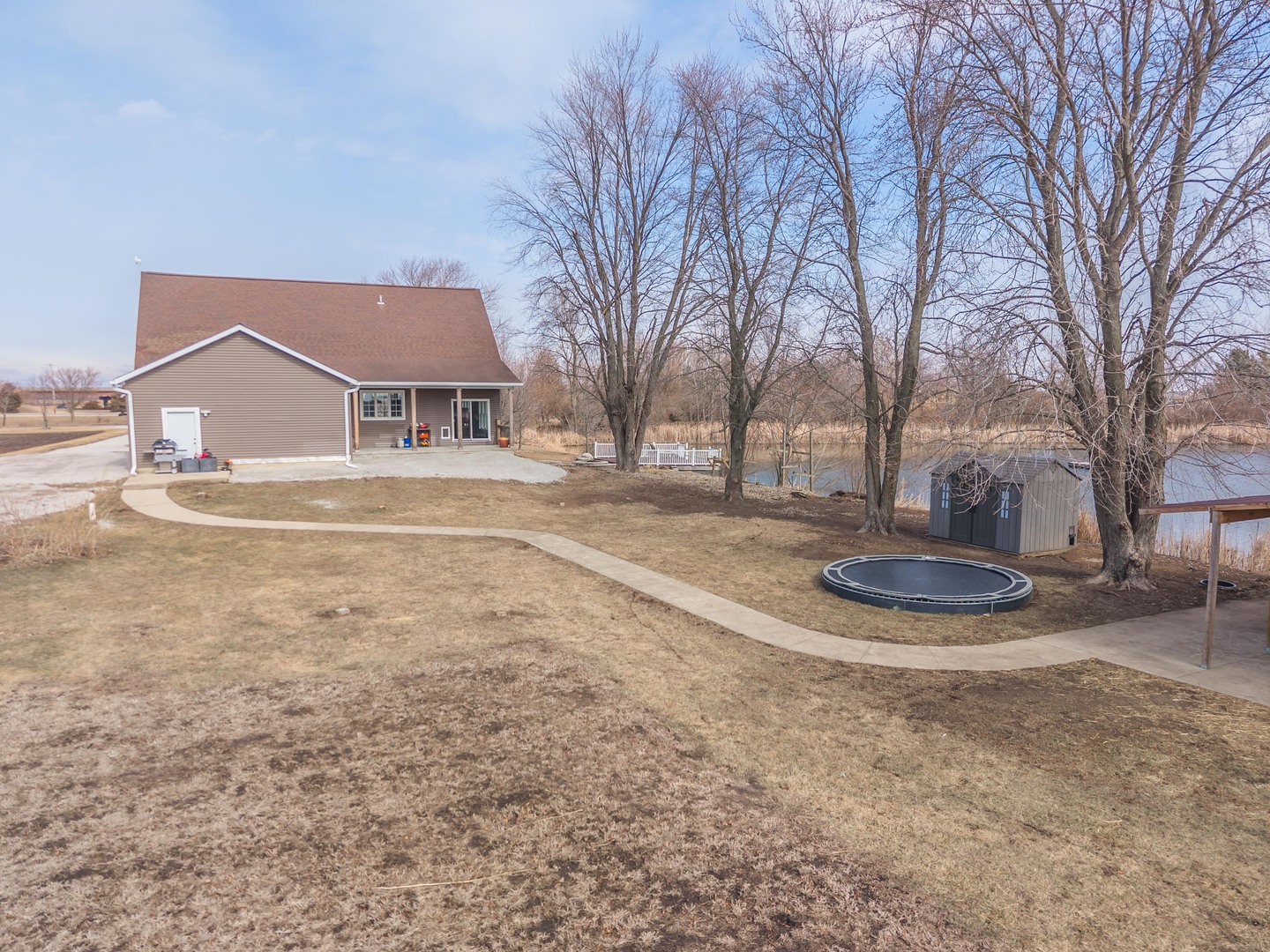 1651 North 2800 East Road Le Roy, IL 61752 - Photo 54 of 90 a view of a large house with a big yard and large trees
