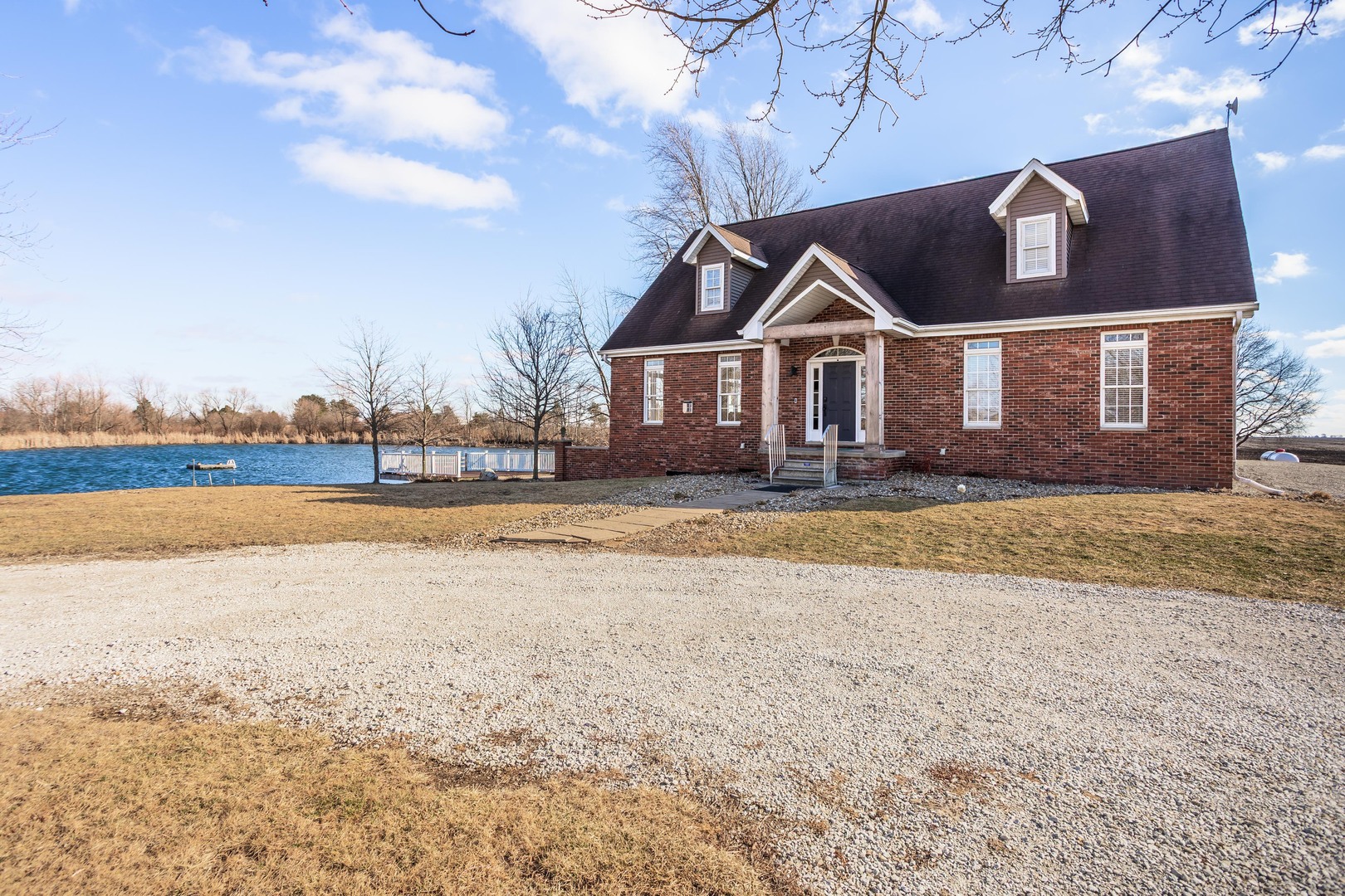 1651 North 2800 East Road Le Roy, IL 61752 - Photo 74 of 90 a front view of a house with a yard and lake view