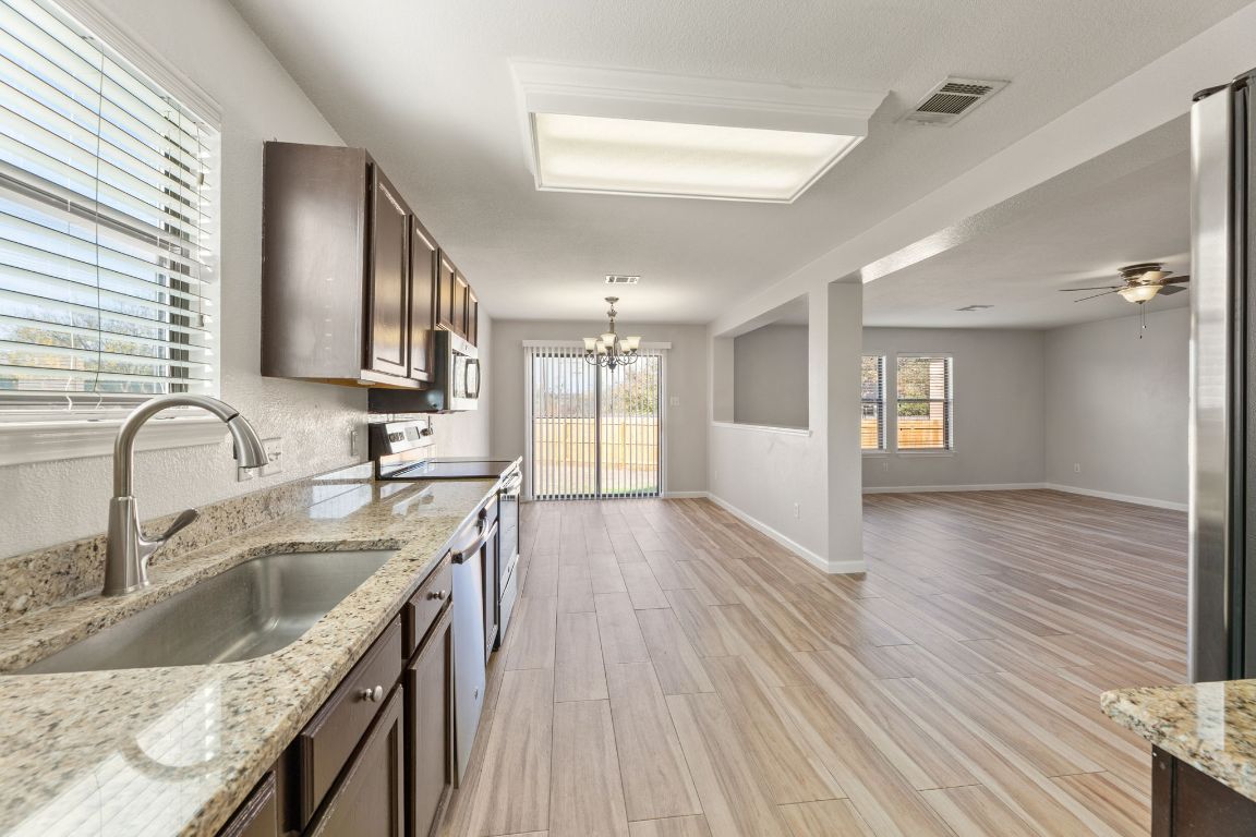 2009 Perkins Place Georgetown, TX 78626 - Photo 15 of 36 a kitchen with a sink window and cabinets