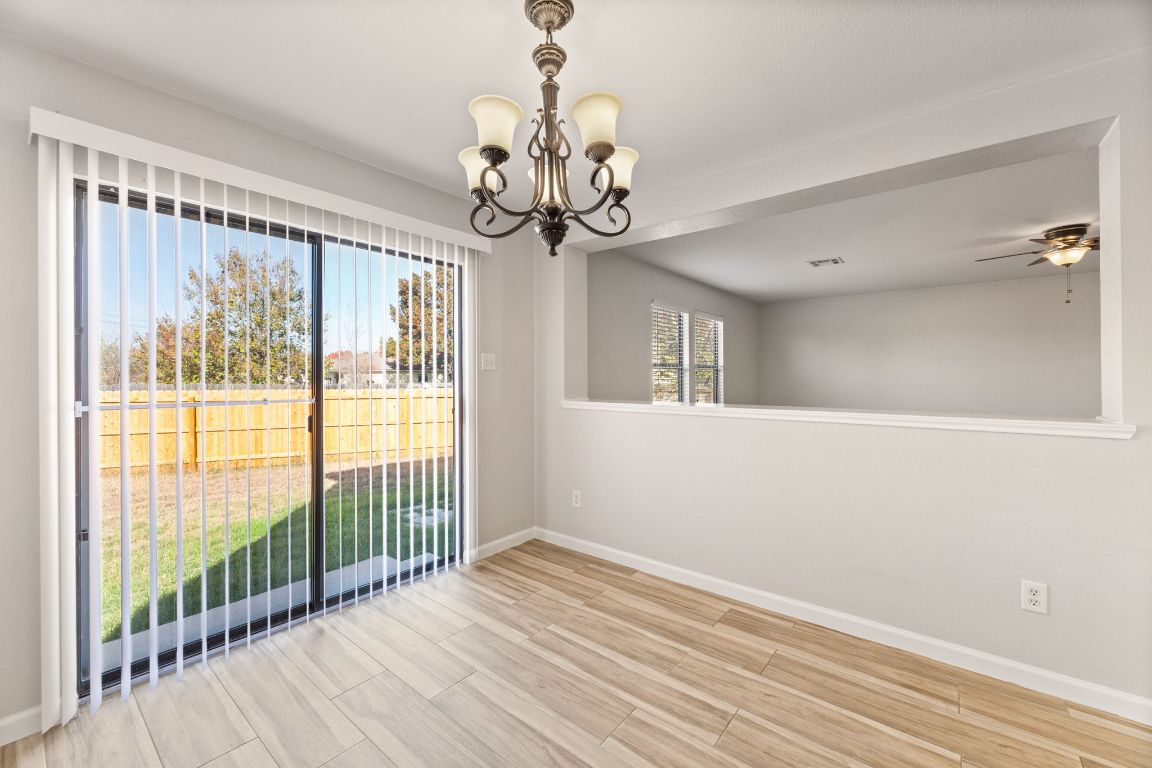 2009 Perkins Place Georgetown, TX 78626 - Photo 19 of 36 a view of a room with wooden floor fan and windows