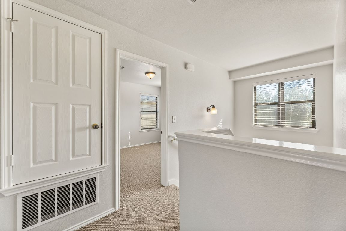 2009 Perkins Place Georgetown, TX 78626 - Photo 22 of 36 a kitchen with stainless steel appliances granite countertop a sink and cabinets with wooden floor