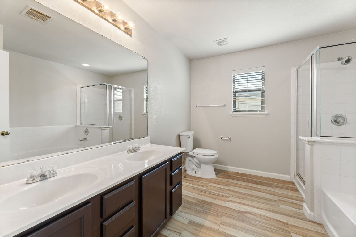 2009 Perkins Place Georgetown, TX 78626 - Photo 29 of 36 a bathroom with a sink a toilet and shower