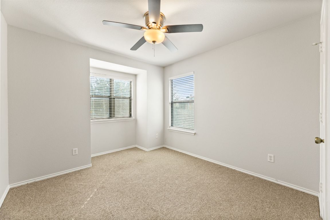 2009 Perkins Place Georgetown, TX 78626 - Photo 31 of 36 an empty room with windows and fan