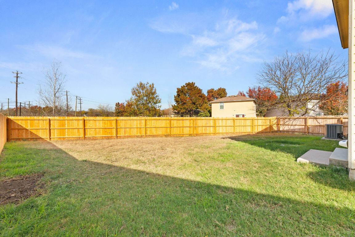 2009 Perkins Place Georgetown, TX 78626 - Photo 33 of 36 a view of yard with swimming pool and green space