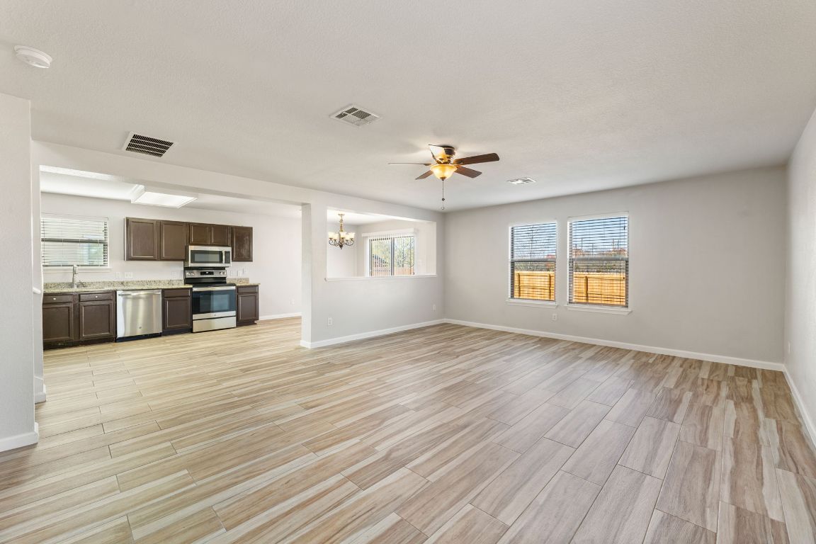 2009 Perkins Place Georgetown, TX 78626 - Photo 8 of 36 a view of an empty room with window and wooden floor