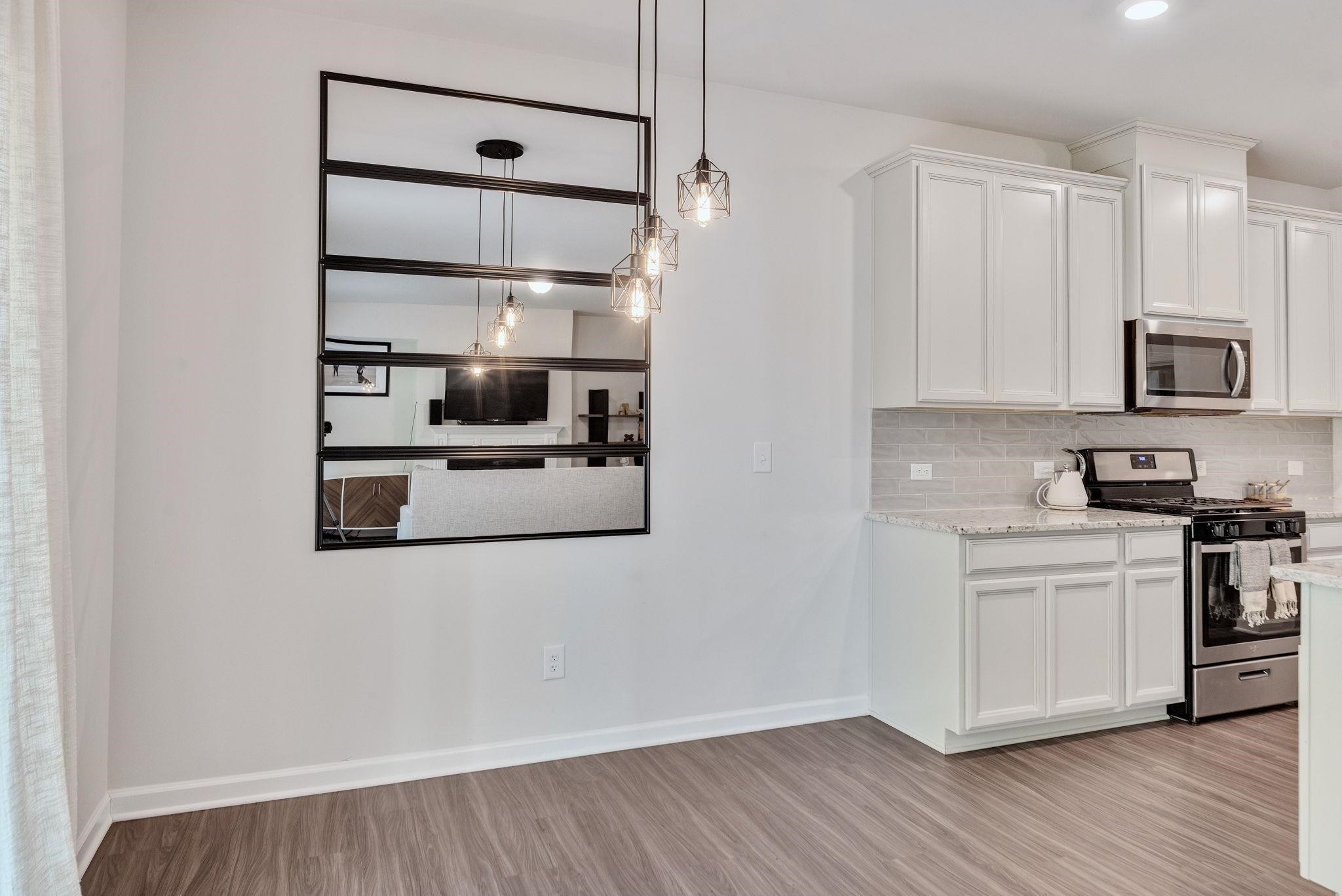 3422 Dropseed Drive Apex, NC 27502 - Photo 18 of 40 a kitchen with stainless steel appliances granite countertop a refrigerator and a stove top oven