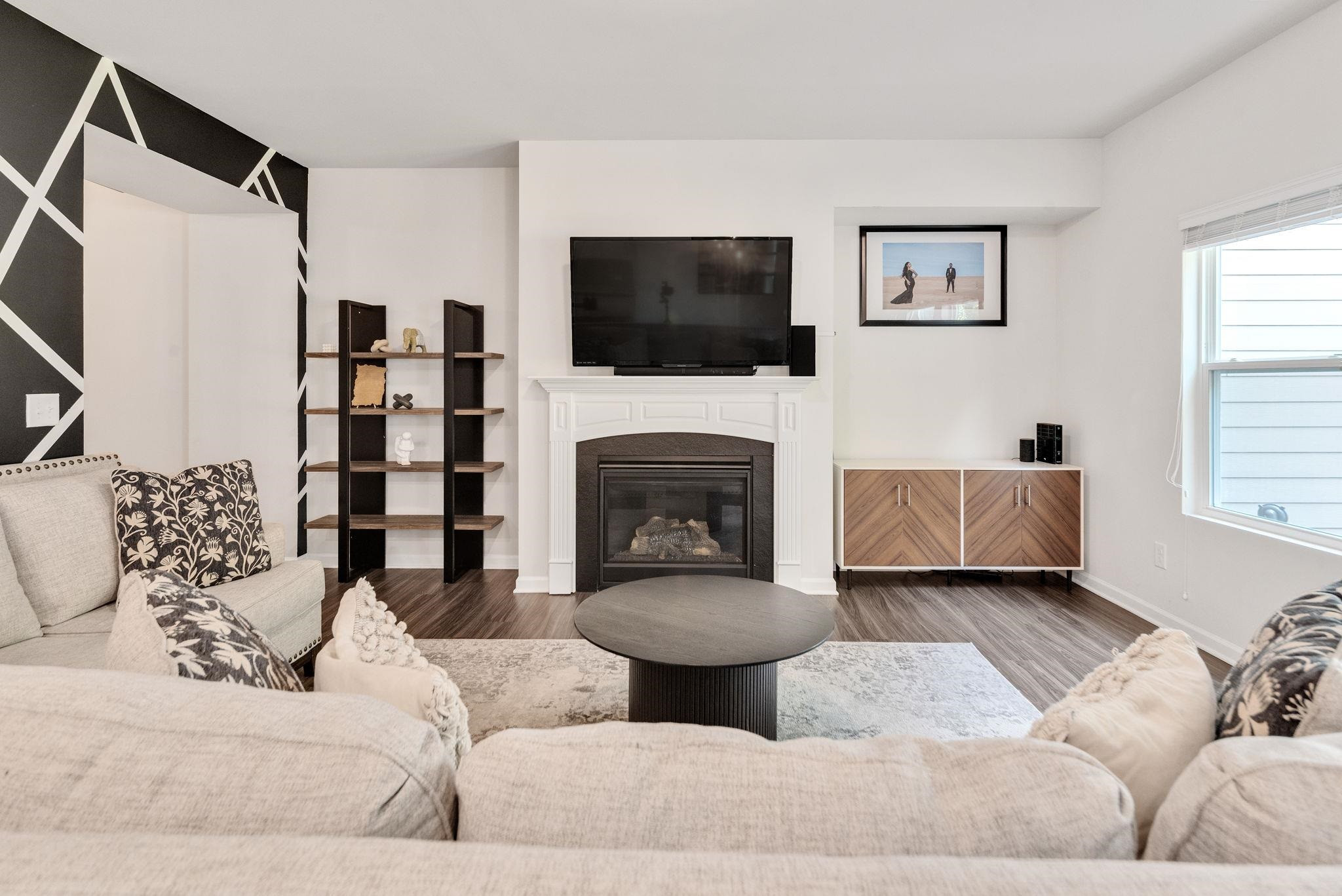3422 Dropseed Drive Apex, NC 27502 - Photo 20 of 40 a living room with furniture and a fireplace