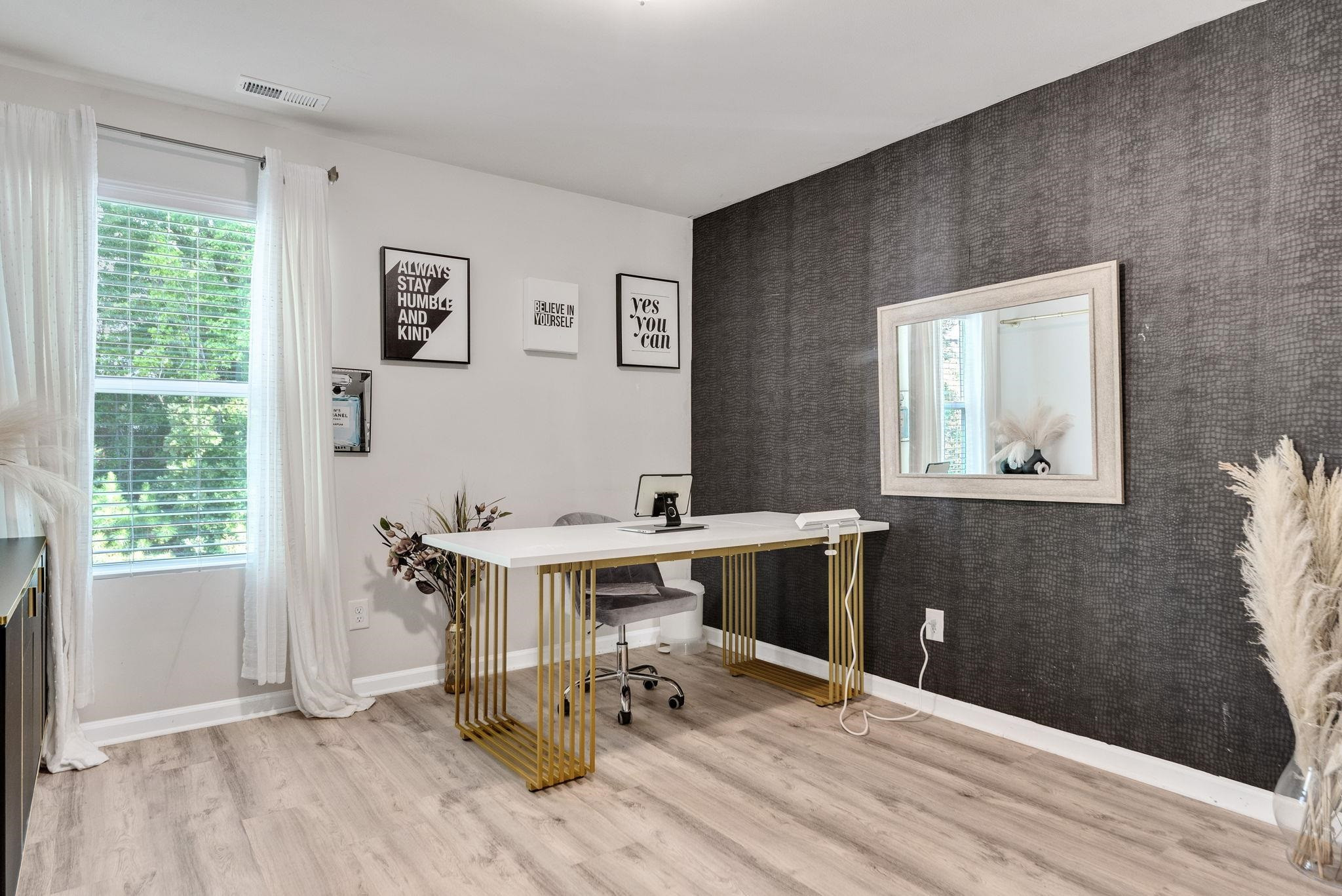 3422 Dropseed Drive Apex, NC 27502 - Photo 25 of 40 a view of a workspace with wooden floor and a window