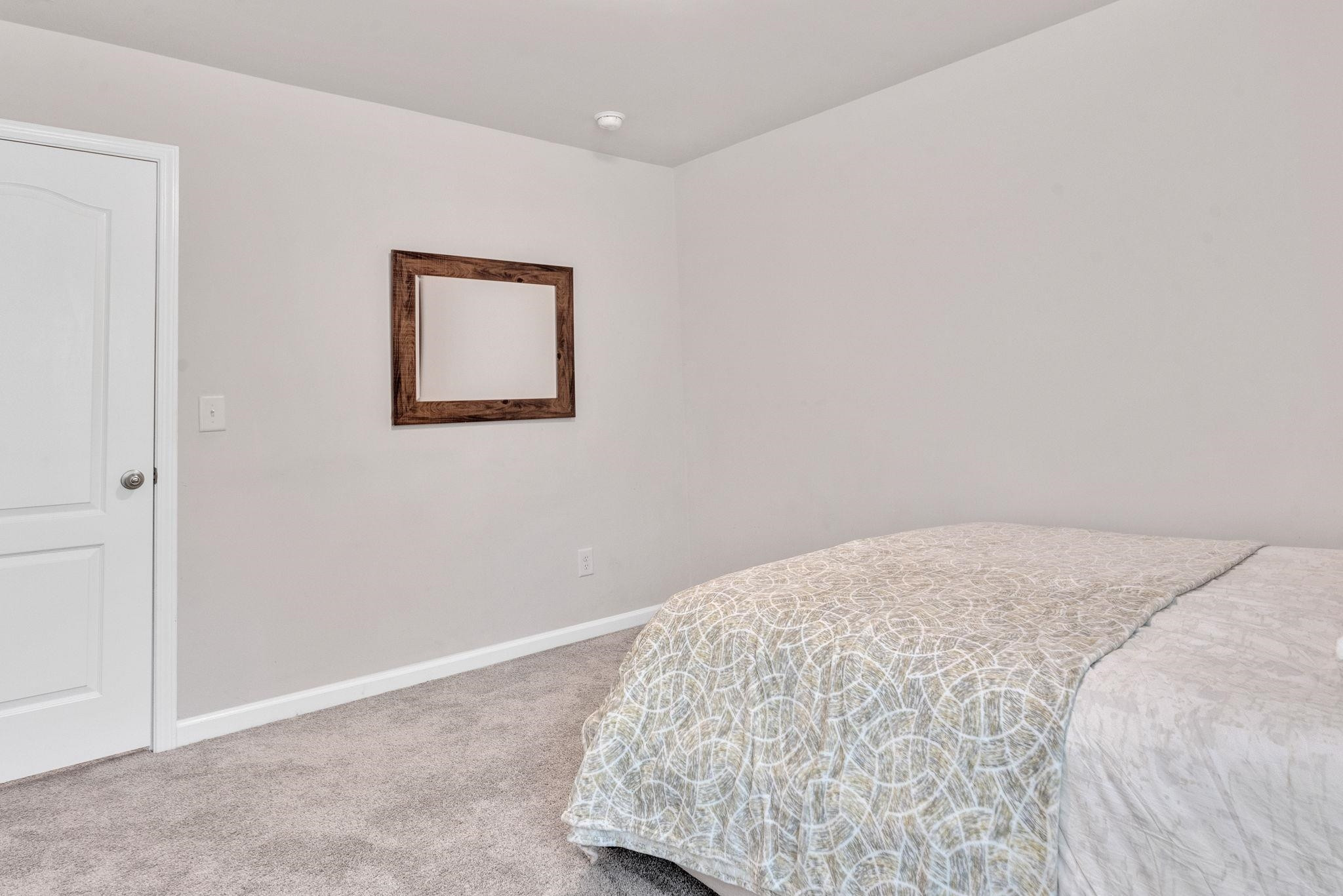 3422 Dropseed Drive Apex, NC 27502 - Photo 29 of 40 a bedroom with a bed and a window