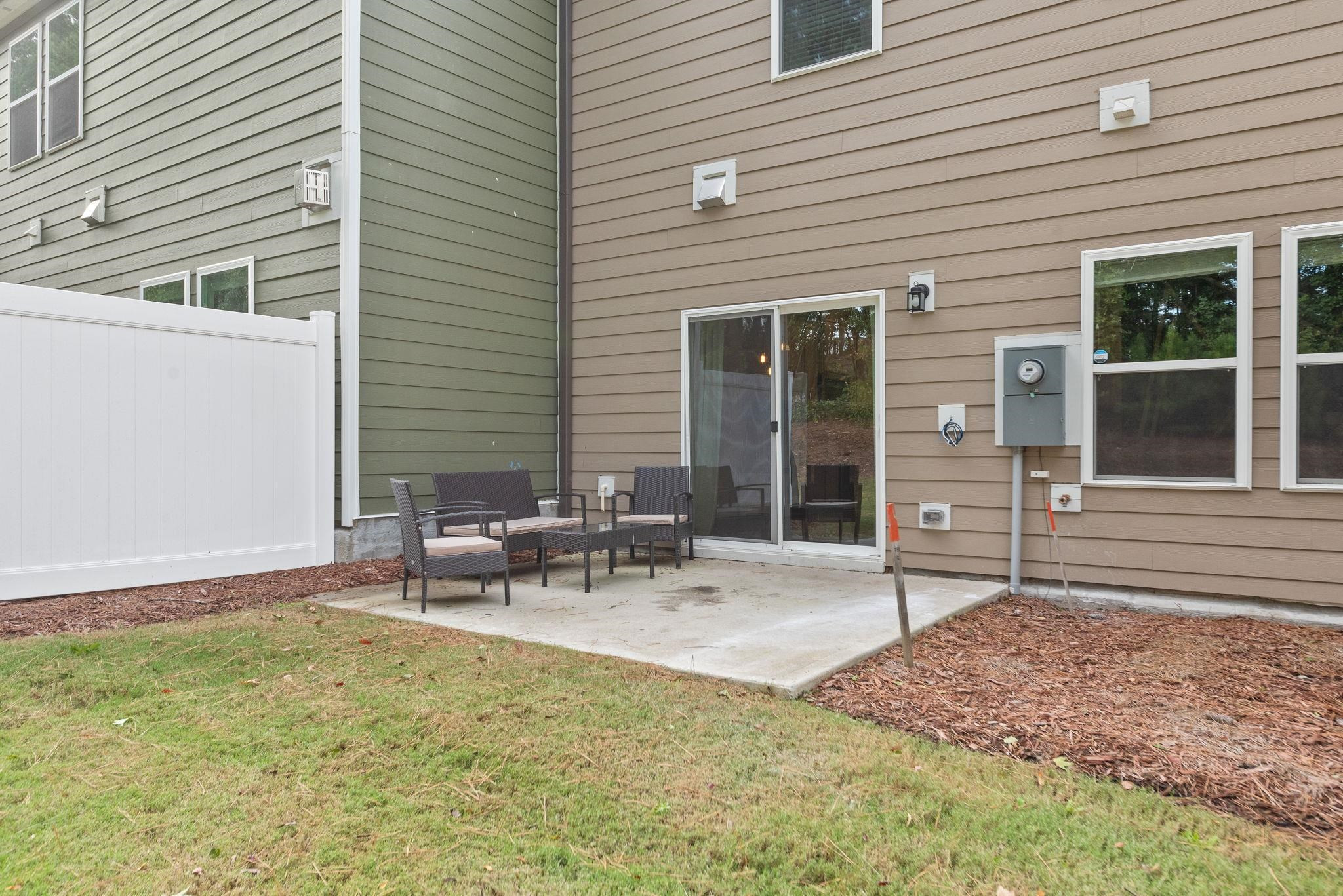 3422 Dropseed Drive Apex, NC 27502 - Photo 33 of 40 a backyard of a house with outdoor seating