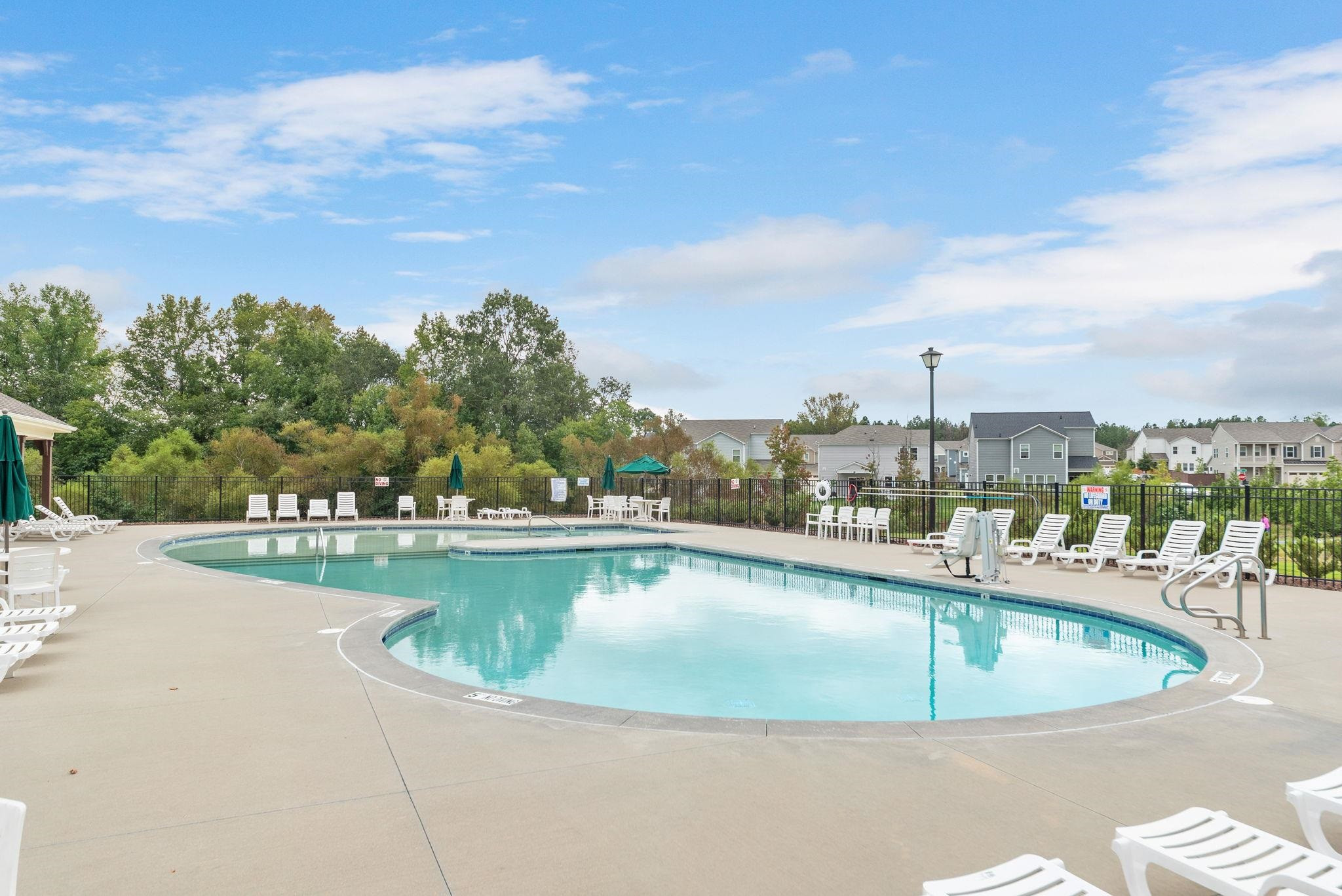 3422 Dropseed Drive Apex, NC 27502 - Photo 36 of 40 a view of a swimming pool with a terrace