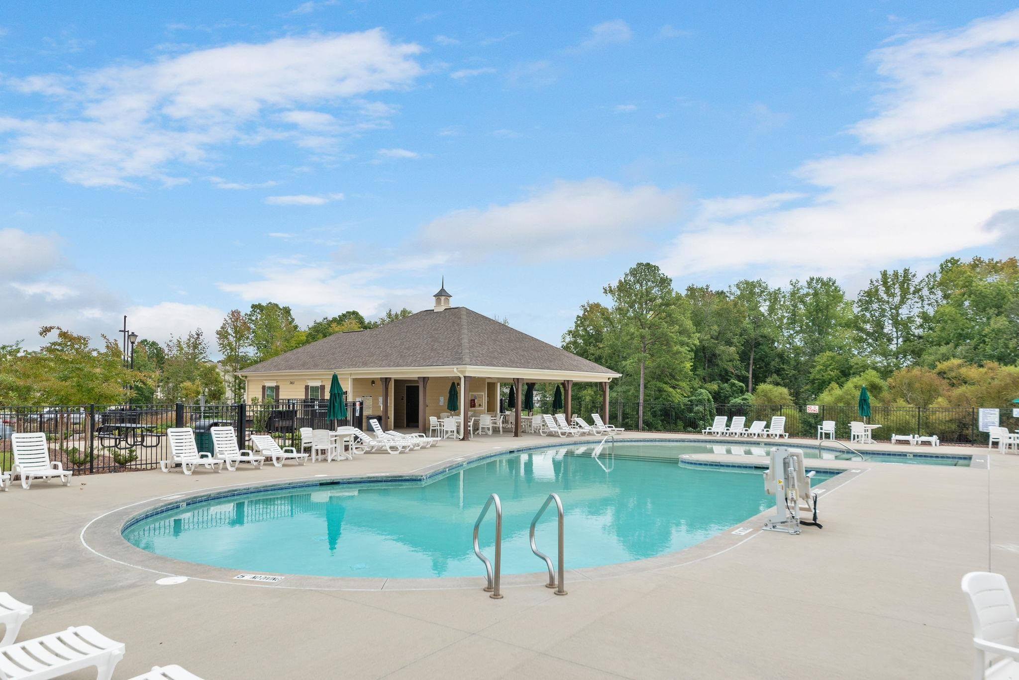 3422 Dropseed Drive Apex, NC 27502 - Photo 37 of 40 a view of a swimming pool with a patio