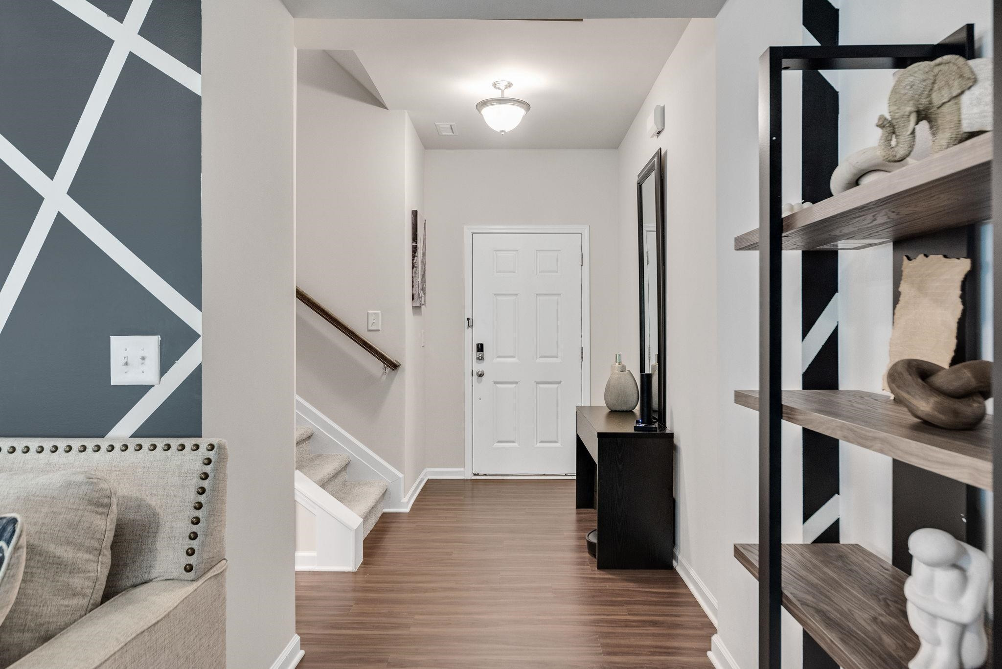 3422 Dropseed Drive Apex, NC 27502 - Photo 6 of 40 a living room with furniture and a flat screen tv