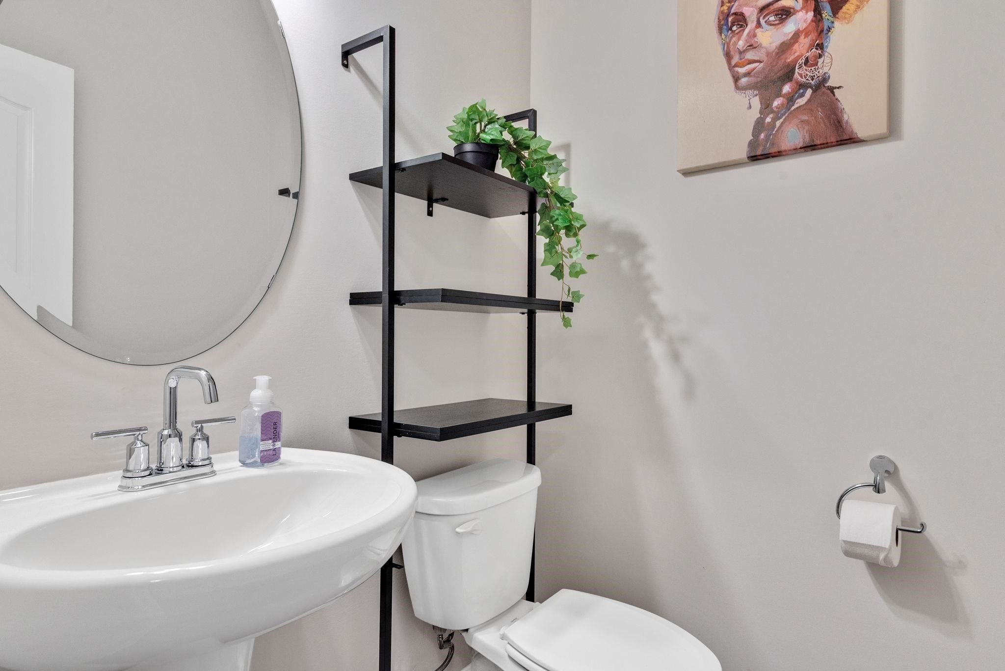 3422 Dropseed Drive Apex, NC 27502 - Photo 8 of 40 a bathroom with a sink toilet and mirror