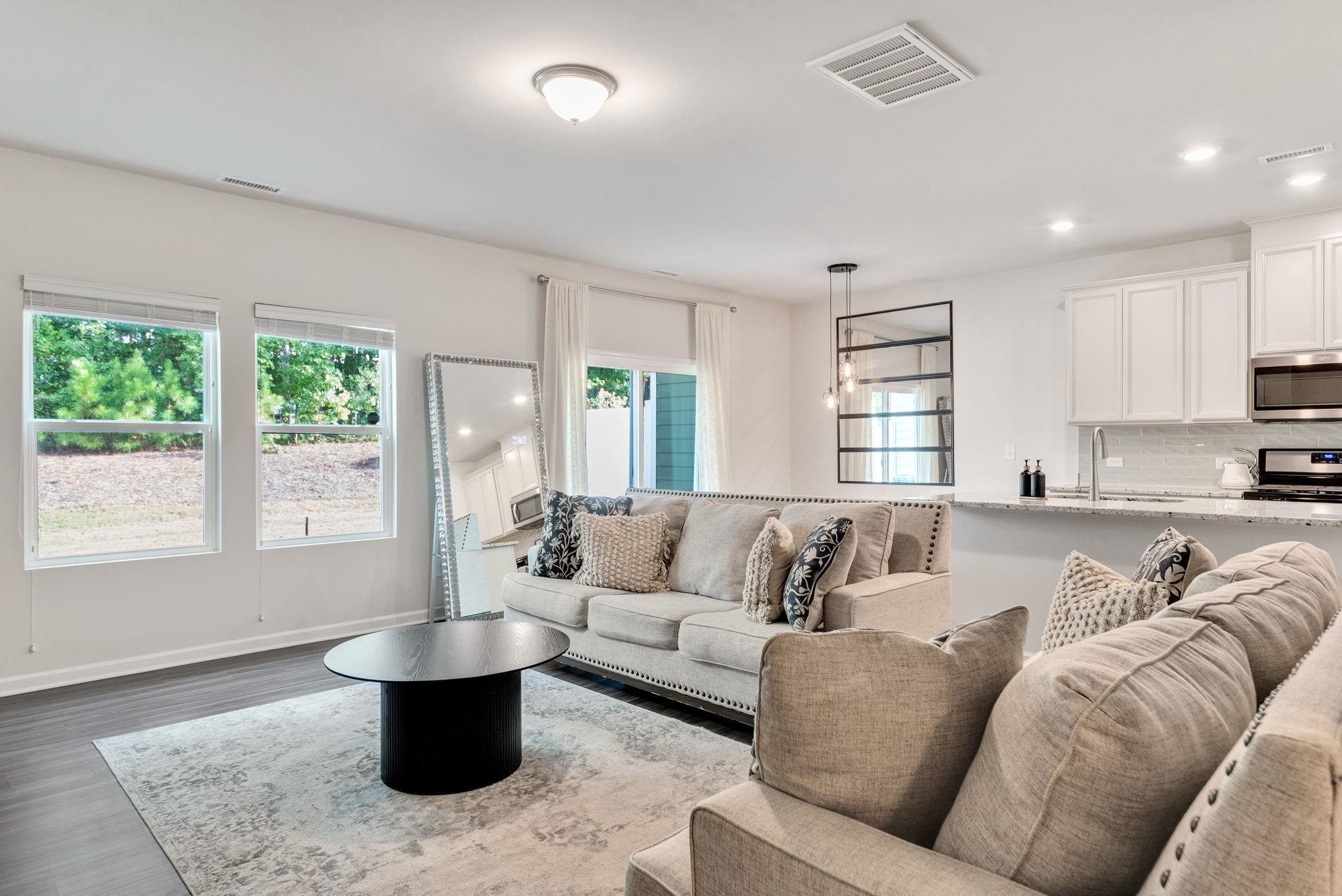 3422 Dropseed Drive Apex, NC 27502 - Photo 9 of 40 a living room with furniture and a large window