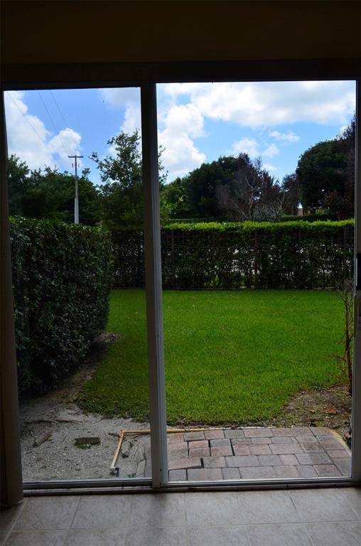 3210 Merrick Terrace, Unit 1503 Margate, FL 33063 - Photo 22 of 24 a view of a garden with a tree