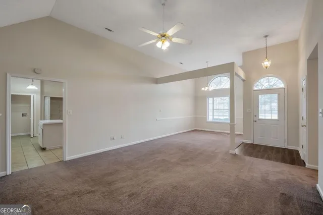 a view of an empty room with a window