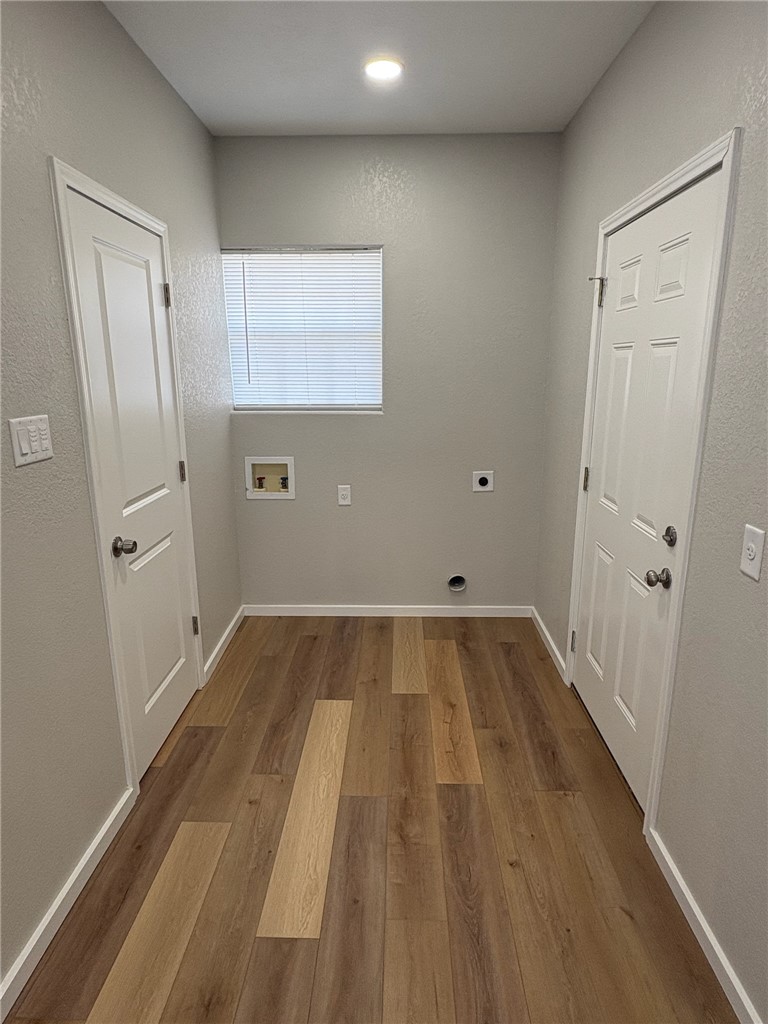 1518 Rochester Street Bryan, TX 77803 - Photo 12 of 23 a view of a room with wooden floor and a hallway