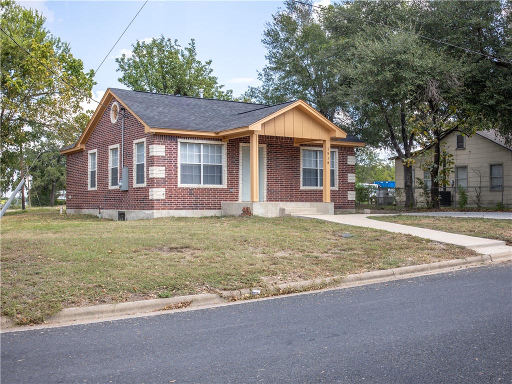1518 Rochester Street Bryan, TX 77803 - Photo 20 of 23 a front view of a house with a yard