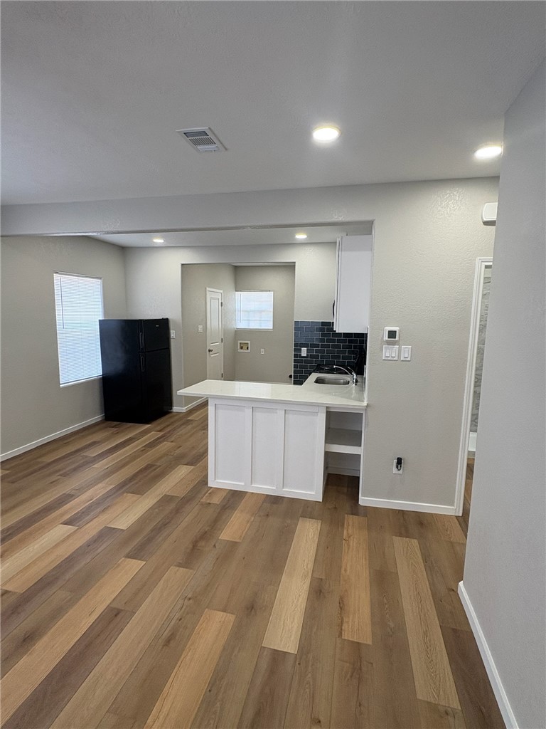 1518 Rochester Street Bryan, TX 77803 - Photo 2 of 23 a large kitchen with a large counter top and stainless steel appliances