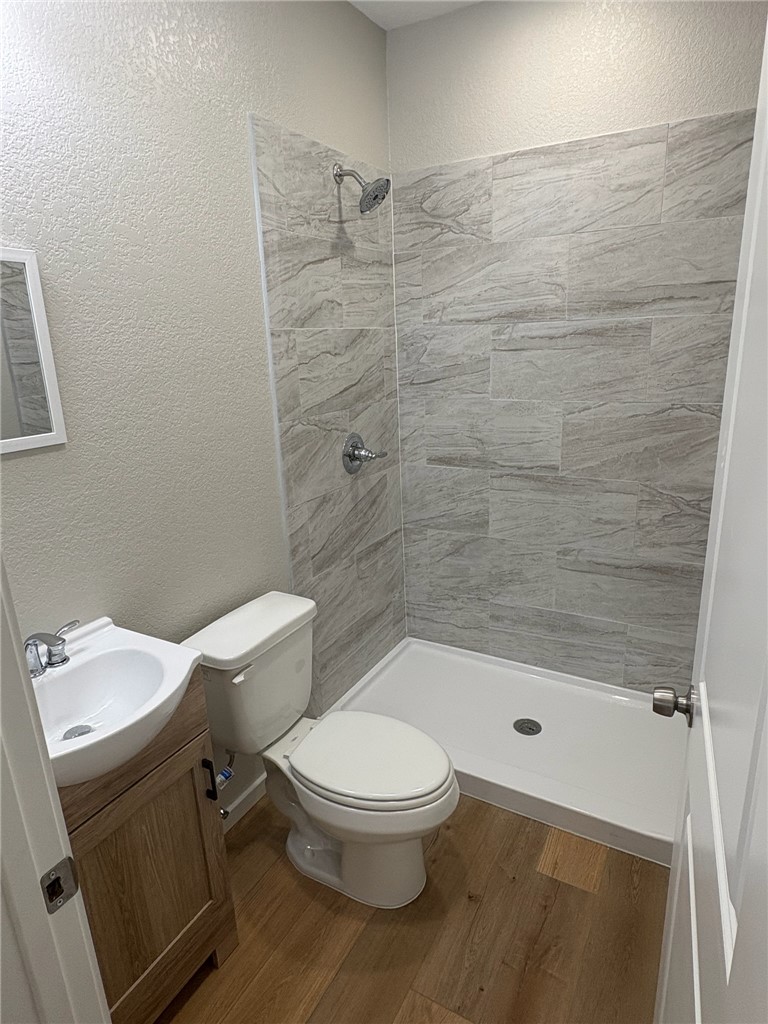 1518 Rochester Street Bryan, TX 77803 - Photo 10 of 23 a white toilet sitting next to a bathroom sink